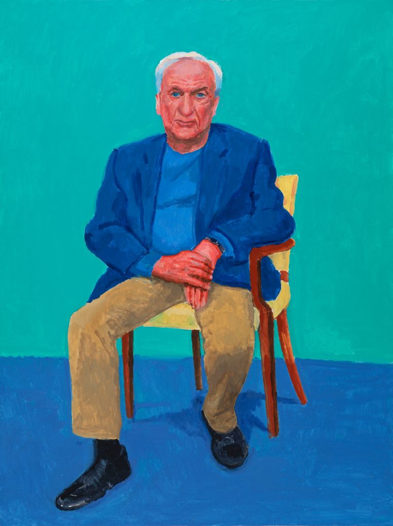 a portrait of a seated white haired man in a casual suit staring right at us, the background is bluey green