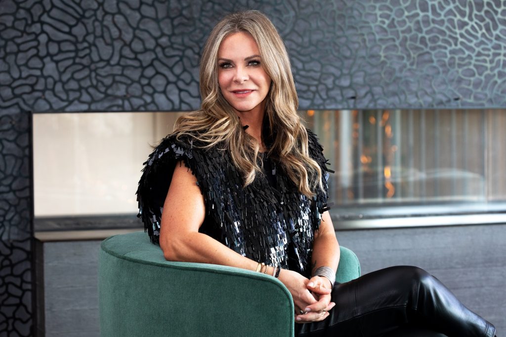 Amanda Precourt, contemporary art collector and founder of the Cookie Factory art space in Denver, seated in a modern interior, 2025 portrait.
