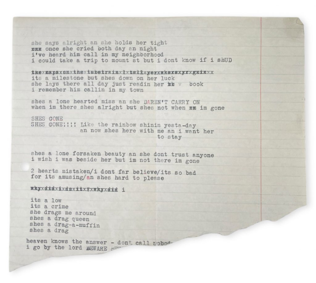 Full typed lyric page with edits, smudges, and torn edge, showing revised song verses