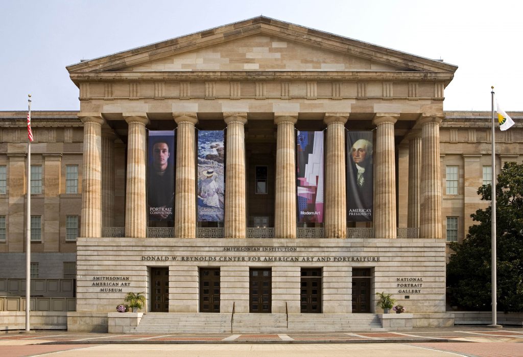 A neo-classical building with a pediment supported by eight columns.