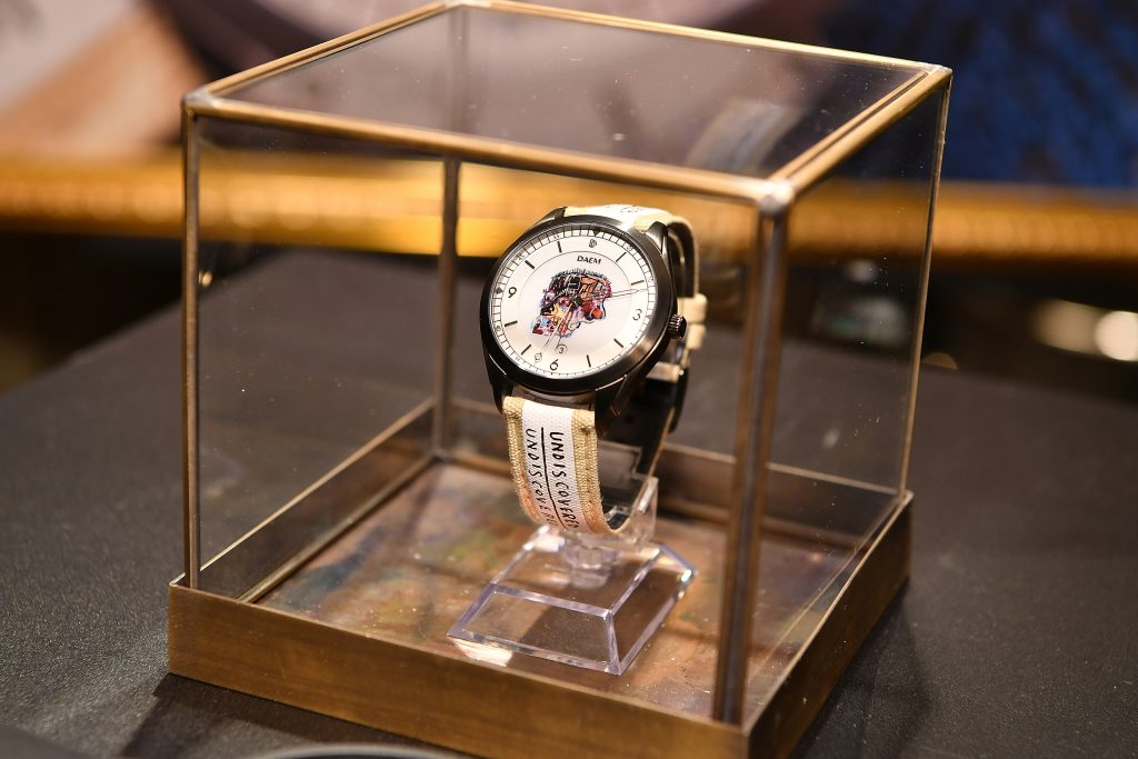 A watch with an artistic skull on its face in a vitrine