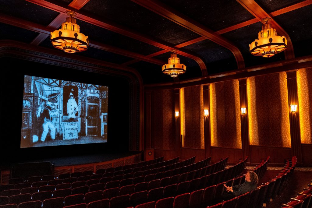 a cinema with lights on the walls