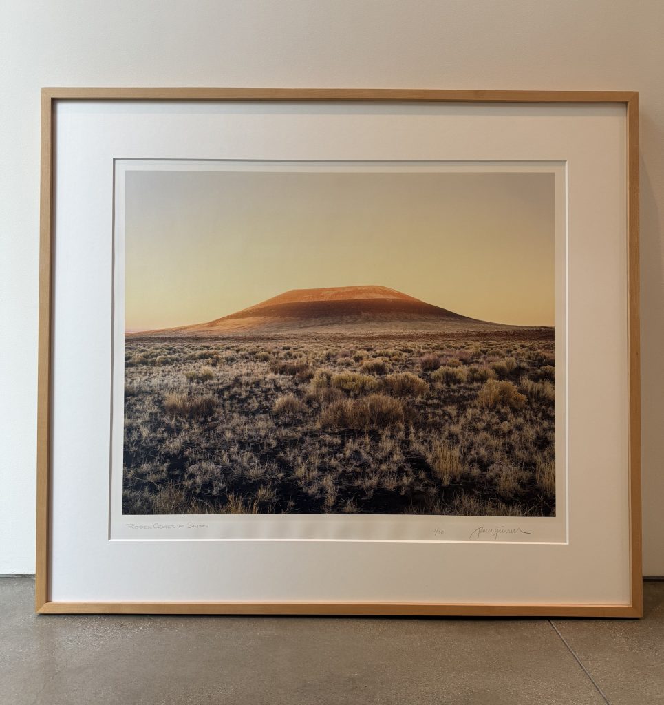 A sunset photograph of a mound in the American Southwest.
