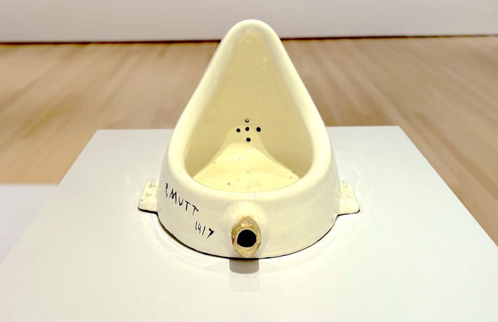 Close-up of Marcel Duchamp’s Fountain, a porcelain urinal signed 