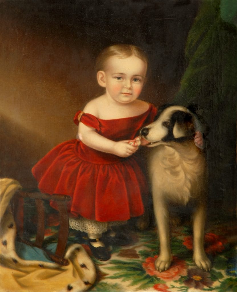 A Sarah Miriam Peale portrait painting of a white toddler with light hair wearing a bright red dress, standing on a patterned rug and holding a small treat toward a black-and-white dog, with another dog partially visible nearby and a dark, softly lit interior background