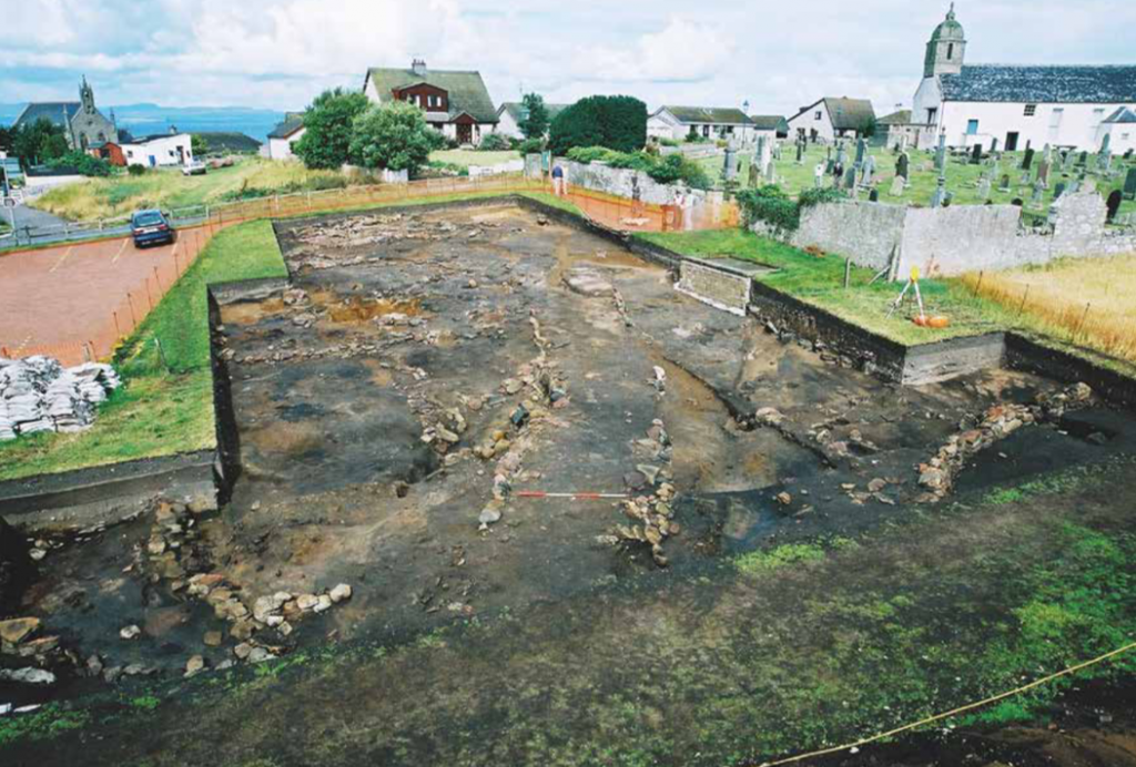 a view of an open tank area with water next to a church